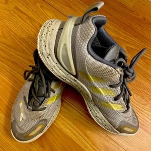 Super cool unique grey and gold Adidas basketball shoes.
